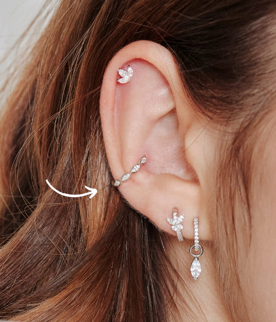 Conch piercing place symbolized with an arrow