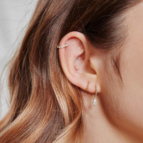 Ear with the Piercing Charm