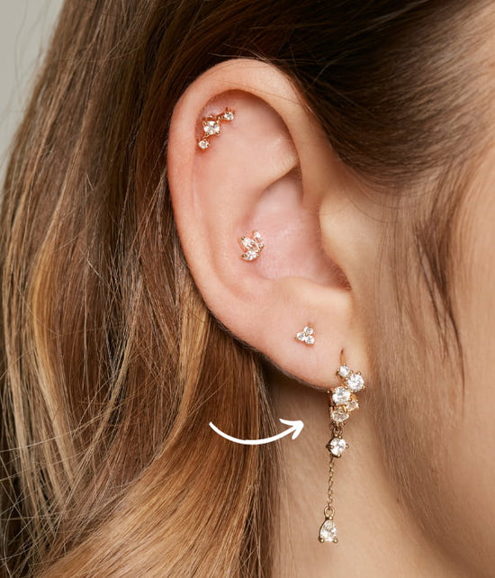 Lobe piercing place symbolized with an arrow