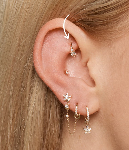 Rook position symbolized with an arrow - ear piercing